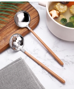 Detail of 304 stainless steel soup and flower slotted spoons with beech wood handles
