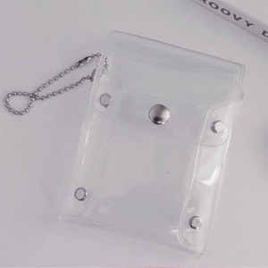 Close-up of clear PVC glitter card holder with silver metal snaps and bead chain