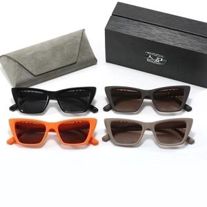 Detail view of cat-eye polarized sunglasses in four colors with luxury storage cases
