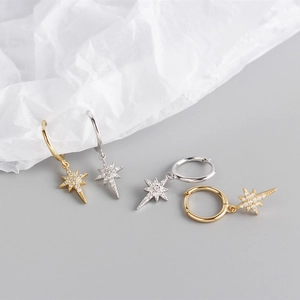 Detailed view of gold and silver S925 silver star hoop earrings with sparkling cubic zirconia