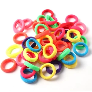Colorful high-elastic seamless nylon hair bands in a mixed set stack on white background