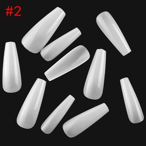 Close-up of translucent white coffin nails size #2 spread on a black background