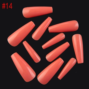 Detailed flat lay of coral orange coffin press-on nails in size #14 with glossy finish