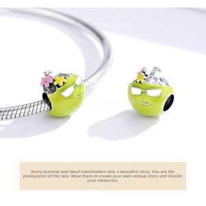 Macro shot of s925 silver coconut charm with colorful enamel and sunglass face detail