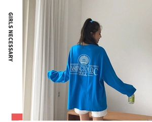 Back view of a blue long-sleeve T-shirt with white Washington D.C. lettering and relaxed fit