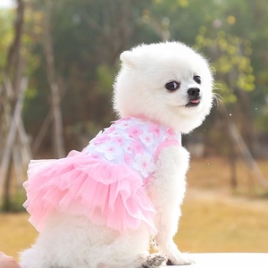 Detail of pink cherry blossom pet dress with 3D floral appliques and layered mesh skirt