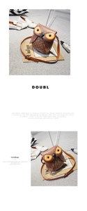 Detailed view of brown owl-shaped crossbody bag with feather texture and long strap