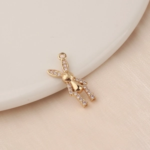 Detailed view of a gold-plated rabbit charm with shimmering cubic zirconia stones
