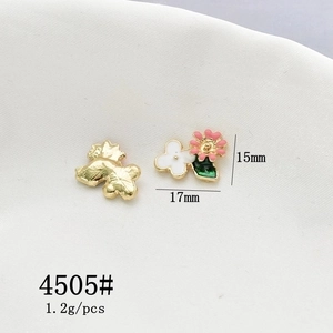 Detail of floral enamel alloy charms for hair accessories featuring pink flower petals