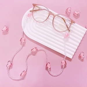 Pink heart crystal eyewear chain with acrylic beads on a stylish pink glasses frame