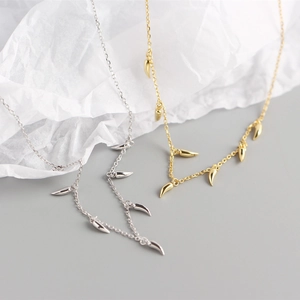 Detail of S925 sterling silver chili spike charm necklace in gold and silver finish