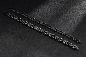 Detail view of black Byzantine stainless steel chains in two different thicknesses