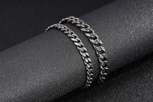 Macro shot of vintage silver Cuban link chain bracelet with oxidized metal details