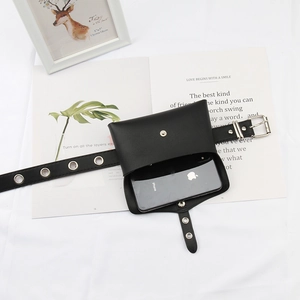 Detail of adjustable black punk waist bag showing space for a smartphone and silver buckles