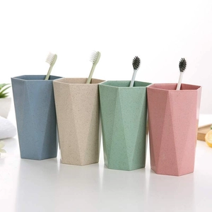 Minimalist hexagonal toothbrush cup set in blue beige green and pink wheat straw material