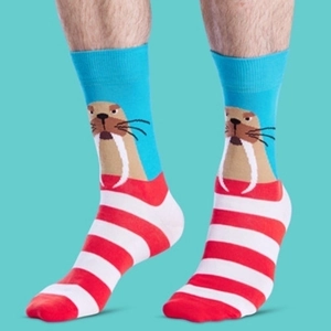 Mid-calf cotton socks featuring a brown walrus head pattern and red white stripes
