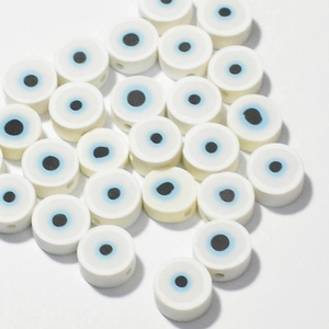 Macro shot of 10mm white evil eye polymer clay spacer beads for DIY jewelry making