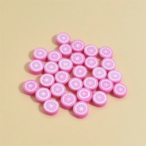 Detailed view of 10mm pink polymer clay beads with grapefruit pattern for DIY jewelry