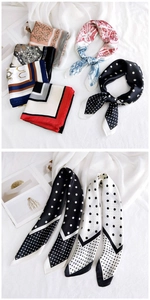 Close-up of elegant square silk scarves with classic polka dots and geometric patterns