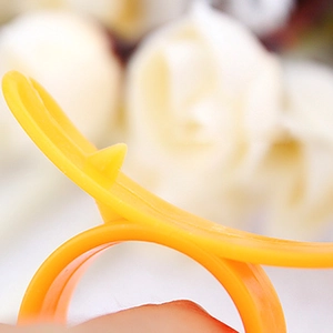 Creative bright yellow plastic orange peeler ring for effortless citrus skin removal