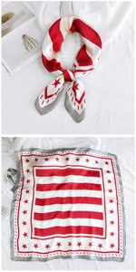 Detail of red star silk scarf showing tied style and flat striped square pattern