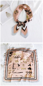 Detailed view of pink silk square scarf with vintage equestrian horse bit patterns