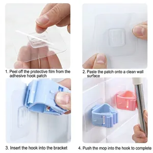 Wall-mounted multi-purpose mop holder with adhesive backing and colorful clips