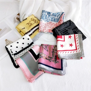 Elegant assortment of silk square scarves in various vibrant prints and colors for women