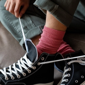 Retro Japanese style red cotton ribbed crew socks shown with black high-top sneakers