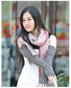 Detailed knit texture of dark grey long arm warmers paired with a pink floral scarf