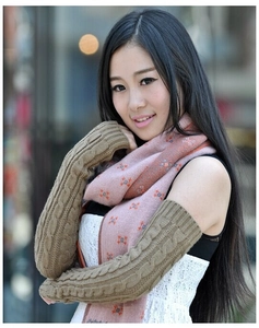 Detail of coffee brown cable knit long arm warmers with cozy winter texture