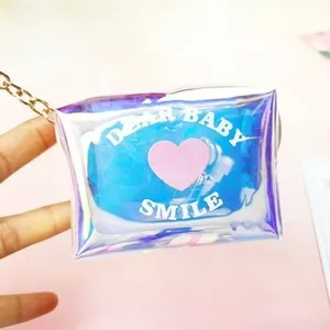 Macro shot of laser purple canvas pencil case with golden chain and pink heart slogan