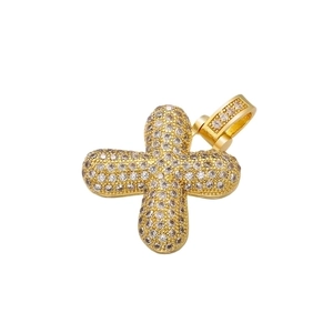 Close-up of hip-hop cross pendant with full diamond inlay on a white background