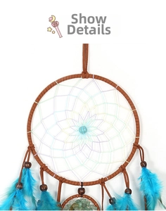 Close-up of bohemian dream catcher with blue feathers and woven tree of life pattern