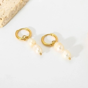 Gold stainless steel hoop earrings with double baroque freshwater pearls on white background