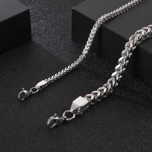 Polished silver stainless steel braided chain link bracelet with lobster clasp closure