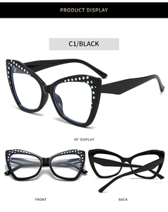Makro-Detail des schwarzen Cat-Eye-Brillengestells mit weißen Punkten am oberen Rand