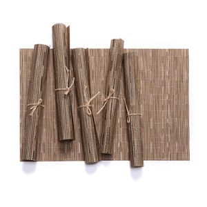 Brown woven PVC placemat set with bamboo texture showing flat and rolled pieces