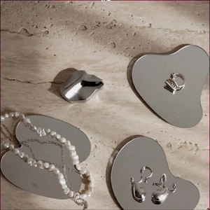 Irregular acrylic mirror tray set with baroque pearl necklace and metal jewelry
