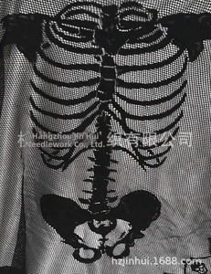 Close-up of white skeleton bone print on black fishnet shawl for Halloween costumes
