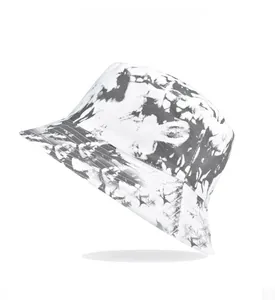 Detail of a tie-dye bucket hat in black and white ink style on a clean white background