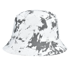 Detail of black and white tie-dye bucket hat showing canvas texture and ink wash pattern