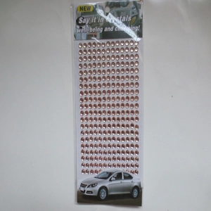 Macro shot of 3mm champagne adhesive acrylic rhinestones for car DIY decoration