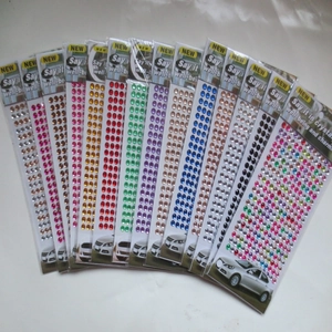 Macro detail of various colorful self-adhesive acrylic gemstone stickers for DIY crafts