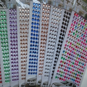 Macro detail of various colorful 3mm acrylic gemstone stickers for DIY craft decoration