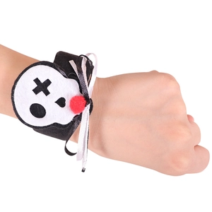Halloween skull slap bracelet with red pom-pom and ribbon for party decoration