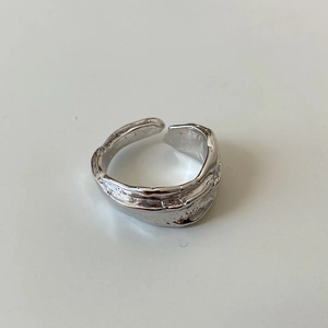 Detailed view of the irregular lava texture on this minimalist 925 sterling silver ring