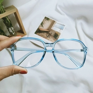 Close-up of a light blue transparent TR90 eyeglasses frame showing details of the hinges