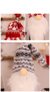 Detailed view of red and grey knitted gnome wine bottle covers with long plush white beards