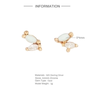 Detail of 925 sterling silver opal earrings with marquise zirconia and 5x4mm opal stone